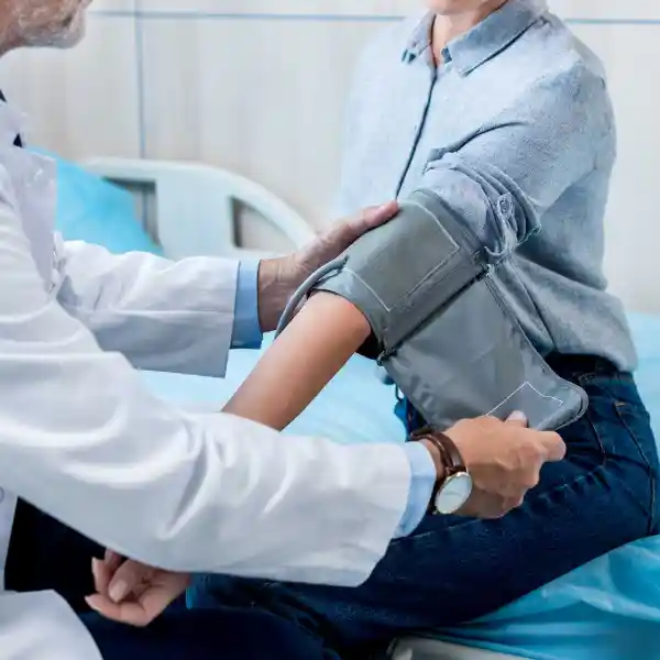 Doctor checking a patients blood pressure